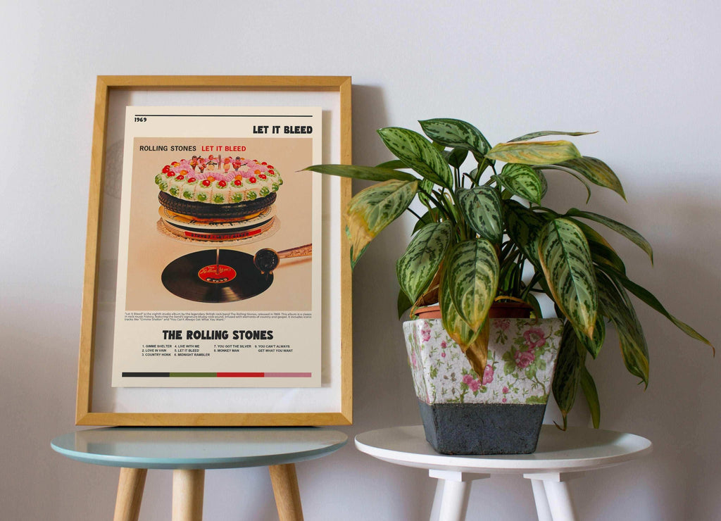 Affiche Let It Bleed des Rolling Stones encadrée posée sur une table près d'une plante, fait en France, livraison gratuite 48h, cadeau idéal Noël